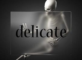 delicate word on glass and skeleton photo