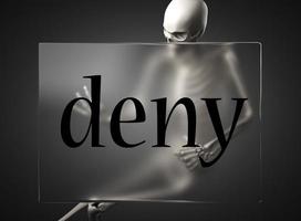 deny word on glass and skeleton photo