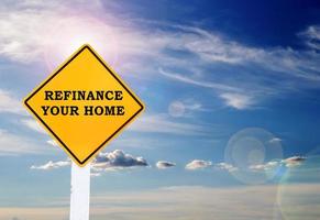 Text for Refinance your home on yellow road sign
