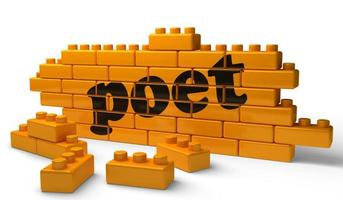 poet word on yellow brick wall photo