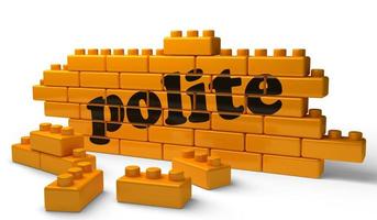 polite word on yellow brick wall photo