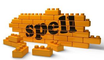 spell word on yellow brick wall photo