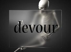 devour word on glass and skeleton photo