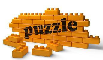 puzzle word on yellow brick wall photo