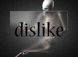 dislike word on glass and skeleton photo