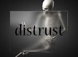 distrust word on glass and skeleton photo
