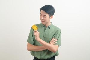 young Asian man holding credit card photo