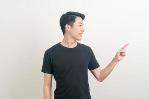 Asian man with hand pointing or presenting on white background photo