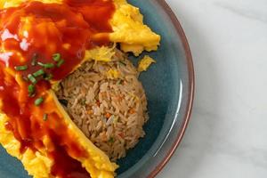 Flavored Fried Rice in an Omelet Wrapping photo