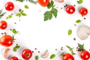 Frame with fresh cherry tomatoes with herbs and spices, top view