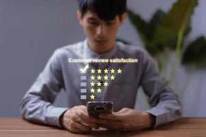 Customer review satisfaction feedback, User give rating to service experience on online application photo