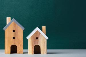 wood home toy craftmanship on peach table and green wall photo