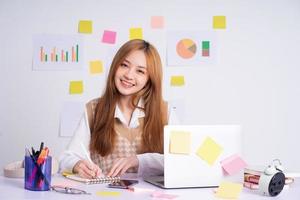 Young Asian businesswoman working concept photo