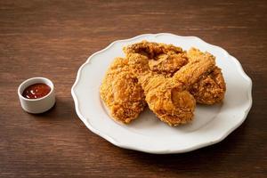 fried chicken with ketchup on plate photo