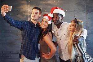Picture showing group of multiethnic friends celebrating New Year photo