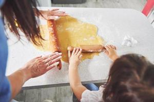 Mom and daughter make homemade cookies. photo