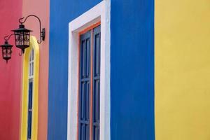 Classic colorful house exterior with door and vintage chandelier photo