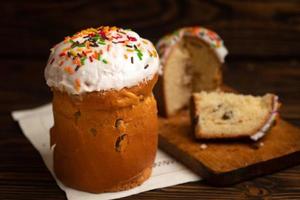 Easter russian traditional orthodox cakes kuliches on a vintage white cloth napkin on wooden boards photo