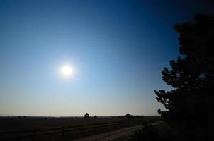 landscape with fence and sun photo