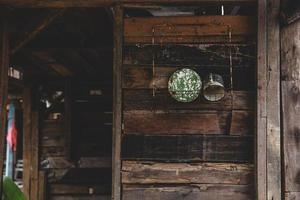 Old metal mug and plate on wooden wall home photo