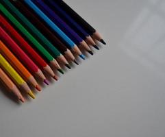 Pencils of different colors lined up photo