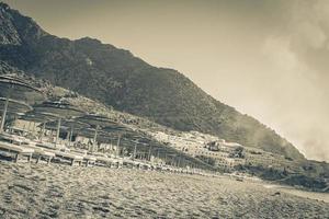 Sunrise and smoke over resorts and beaches on Kos Greece. photo