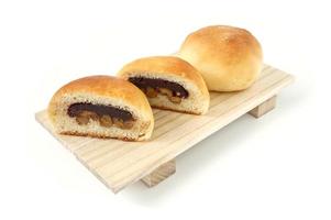 Freshly baked buns lotus red bean cut in half put side by side photo