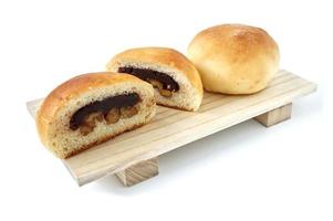 Freshly baked buns lotus red bean cut in half put side by side photo