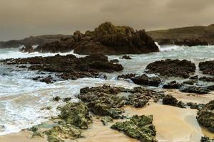 Sea rocks of a beach in Cantabria, Spain. Horizontal image.