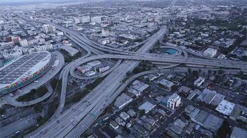 4K Aerial Sequence of Los Angeles, USA - The Highway 10 and 110 intersection at dusk as seen from a helicopter