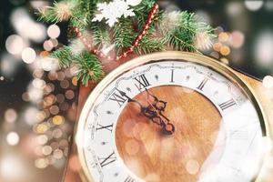 New Year's Clock. Old watches and Christmas decorations. Concept of New Year and Christmas. photo