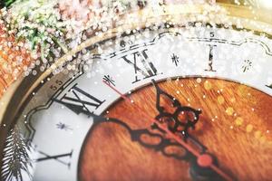 Happy New Year at midnight 2018, Old wooden clock and fir branches photo