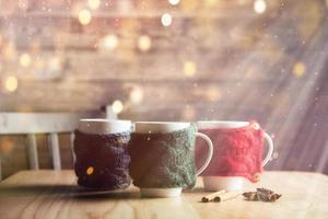 Christmas background with three cups of hot tea, valentines day. Happy new year photo