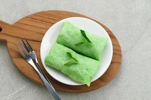 Sweet coconut pancake, Indonesian dessert made from flour with grated coconut mixed palm sugar. photo