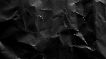 black crumpled paper texture background with copy space for text or image photo