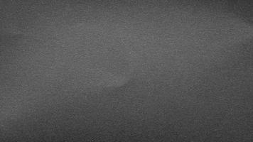 texture of black matte paper grainy gray effect canvas. seamless texture grainy noise effect on dark gray photo