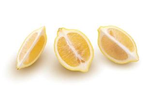 Ripe slice of yellow lemon citrus fruit isolated over white background photo
