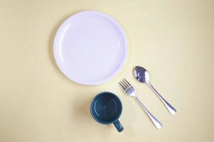 empty plate with spoon and glass photo