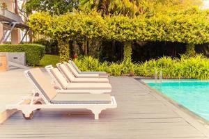 chair pool around swimming pool in hotel resort photo