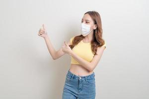 portrait beautiful woman wearing mask with ok or agree hand sign photo