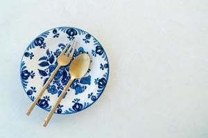 beautiful vintage porcelain plate on white table photo