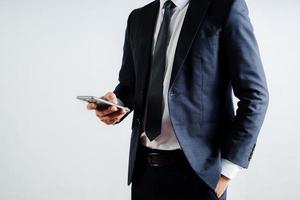 businessman using mobile phone on a white background photo