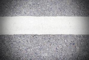 Road asphalt texture with white line photo
