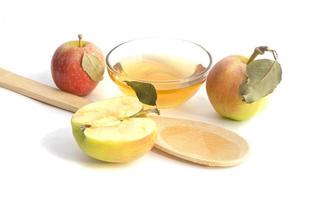 Vegetarian fruit composition.Several objects of apple cider vinegar isolated on white background. photo