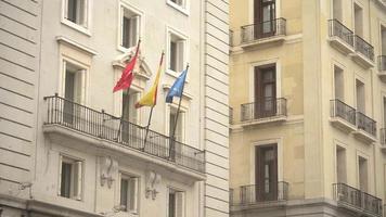 Flags of Spain and European Union on the Building in Madrid