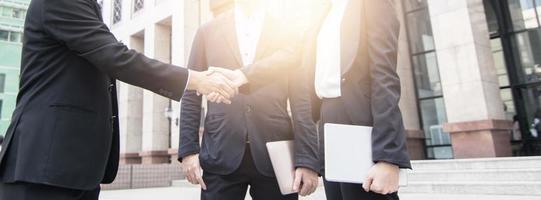 Success business, successful agreement negotiation and confident  partner cooperation concept, Businessman shake hands with customer in banner background photo