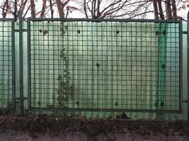 metal net and corrugated plastic fence background photo