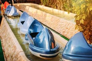 children's attraction with boats in amusement park