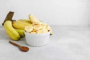 fresh banana slices in a bowl photo