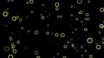 fundo de movimento de partículas de círculo amarelo. animação de papel de parede desbotada com cor preta. bolha voadora. video